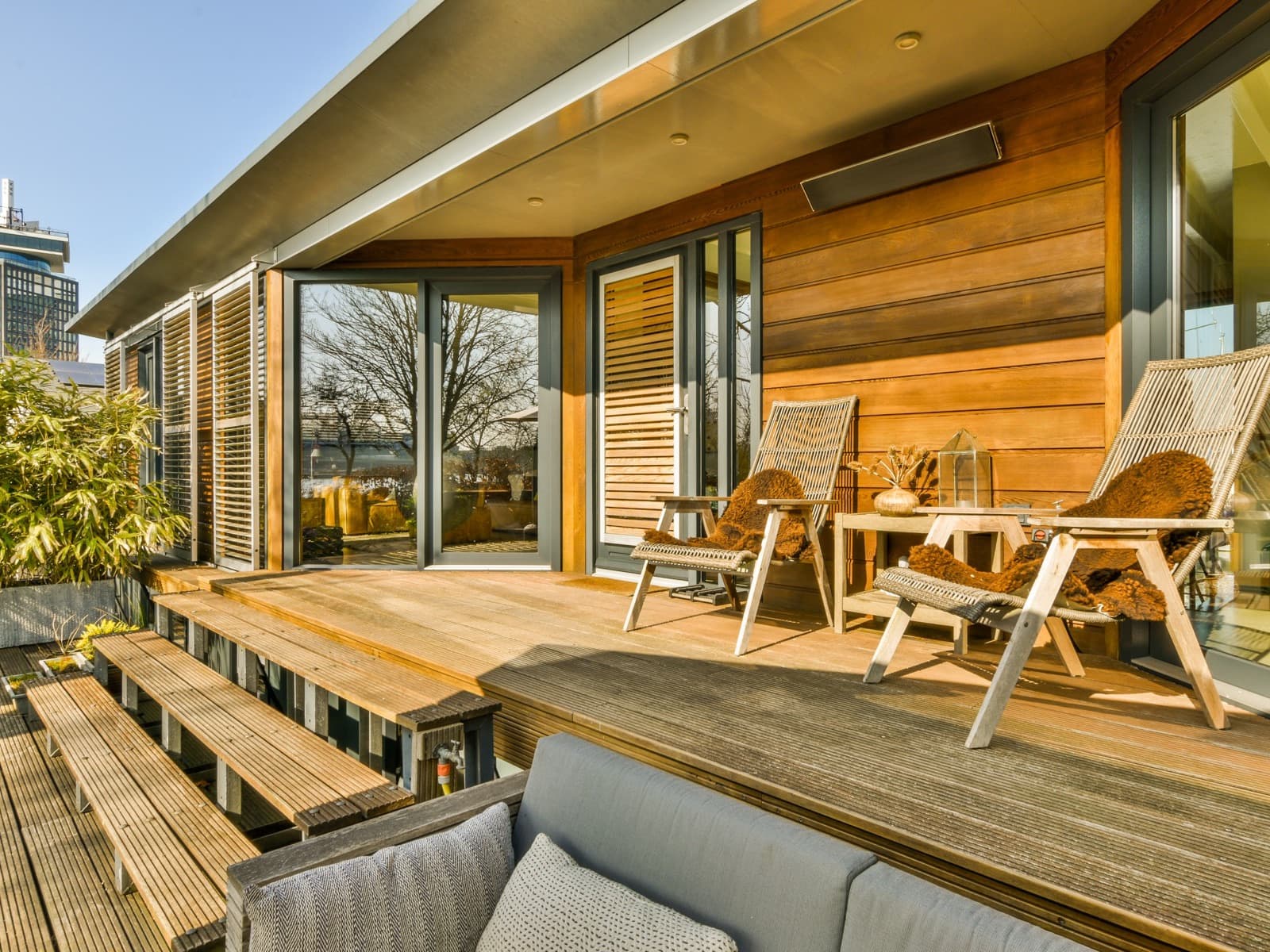 Neat wooden patio with seating.