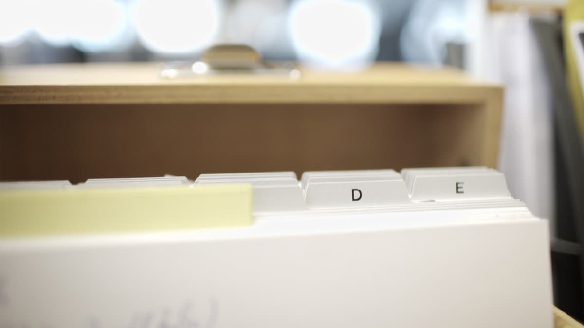 Tabbed folders standing in an open file drawer