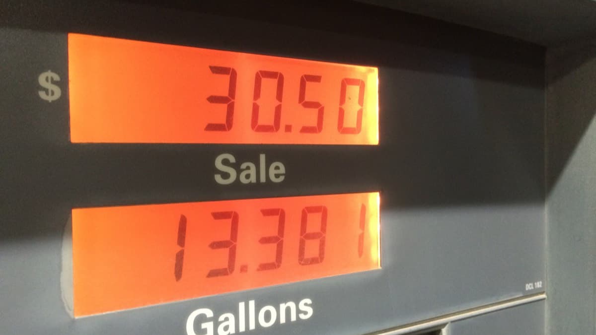 A gas pump display showing the sale amount and gallons pumped